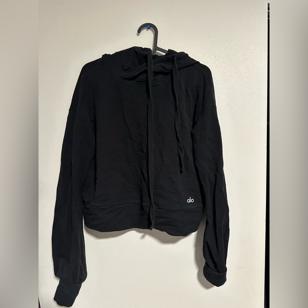 Black Alo sweater great for workout out or enjoying a brisk walk.